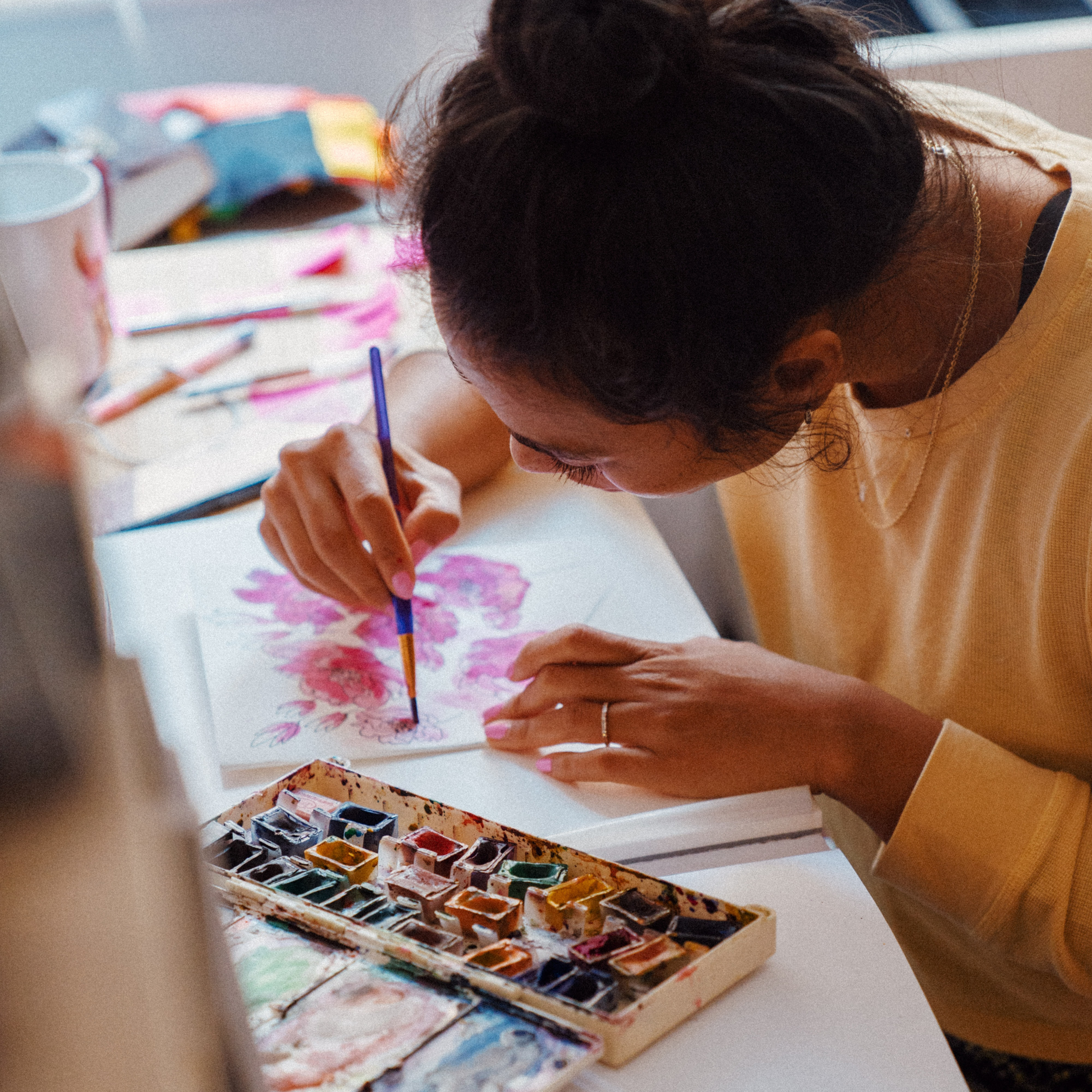 a photograph of a person painting